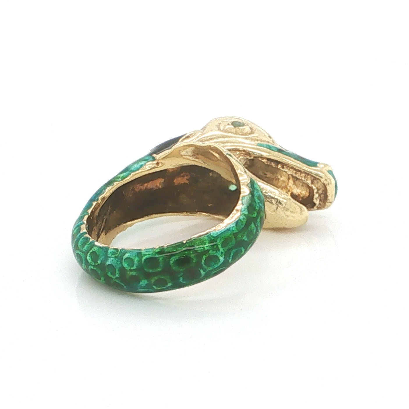 Back view of the sculptural 18k yellow gold snake ring showcasing the coiled body with vibrant green enamel detailing.