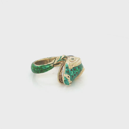 18k yellow gold snake statement ring with vibrant green enamel and a natural emerald accent.