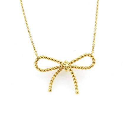 Tiffany & Co. Twisted Cable Wire 18k Yellow Gold Bow Pendant Necklace | Necklaces | catalog, Designer Jewelry, Necklaces, Pendants, Tiffany & Co. | Tiffany & Co.