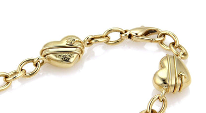 Tiffany & Co. 18k Yellow Gold Cupid 4 Heart Charms Chain Link Bracelet